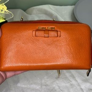 EUC BURNT ORANGE BOW MIU MIU LONG ZIPPY WALLET WITH ✨SHINY✨GOLD HARDWARE